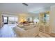 Light and bright living room boasts wood floors and an oversized mirror wall at 19029 Us Highway 19 N # 31F, Clearwater, FL 33764