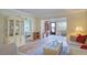 Cozy living room with hardwood flooring, comfortable seating, and water views at 19029 Us Highway 19 N # 31F, Clearwater, FL 33764
