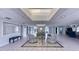 Inviting lobby area featuring comfortable seating, neutral tones, and ample natural light from the skylight at 19029 Us Highway 19 N # 31F, Clearwater, FL 33764
