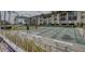 Active adult community featuring shuffleboard courts, a putting green, and waterfront access for leisure and recreation at 19029 Us Highway 19 N # 31F, Clearwater, FL 33764
