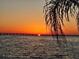 Scenic sunset view over the water, showcasing a bridge silhouetted against the colorful sky at 19029 Us Highway 19 N # 31F, Clearwater, FL 33764