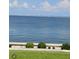 Expansive water view featuring a bridge and blue skies with a concrete barrier and shrubbery in the foreground at 19029 Us Highway 19 N # 31F, Clearwater, FL 33764