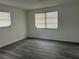 Inviting bedroom with ample natural light, modern flooring, and neutral decor, offering a serene and comfortable retreat at 2075 Plateau Rd, Clearwater, FL 33755
