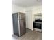 Charming kitchen featuring stainless steel appliances, ample storage, and modern finishes, creating a functional and stylish space at 2075 Plateau Rd, Clearwater, FL 33755