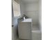 Functional laundry room with a side-by-side washer and dryer and tiled floors at 2075 Plateau Rd, Clearwater, FL 33755