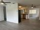 Spacious living area seamlessly connected to a stylish kitchen, creating an ideal space for entertaining and relaxation at 2075 Plateau Rd, Clearwater, FL 33755