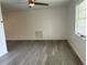Bright, spacious living area with modern flooring and ample natural light, perfect for relaxation and entertaining at 2075 Plateau Rd, Clearwater, FL 33755