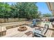 Wooden backyard deck with built-in benches, a fire pit, and outdoor seating at 2122 W Ferris Ave, Tampa, FL 33603
