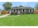 Charming home showcasing a well-manicured lawn, fresh landscaping, and inviting curb appeal at 2122 W Ferris Ave, Tampa, FL 33603