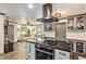 Modern kitchen with a spacious island, stainless steel appliances, and stylish gray cabinetry at 2122 W Ferris Ave, Tampa, FL 33603
