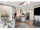 Open-concept living room featuring an island kitchen, hardwood floors, and modern gray interior at 2122 W Ferris Ave, Tampa, FL 33603