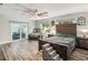 Stylish main bedroom boasting hardwood floors, ample natural light, and a sliding glass door to the patio at 2122 W Ferris Ave, Tampa, FL 33603