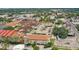 An aerial view shows the building with a rooftop parking lot and surrounding apartments in an urban environment at 2402 Azeele W St # 412, Tampa, FL 33609