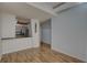 Inviting living room featuring wood floors and an open layout to the kitchen area at 2402 Azeele W St # 412, Tampa, FL 33609