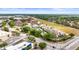 Wide aerial view of the community showing various buildings and surrounding landscape at 2597 Countryside Blvd # 206, Clearwater, FL 33761