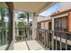 Exterior balcony with a courtyard view with mature trees and landscaping at 2597 Countryside Blvd # 206, Clearwater, FL 33761
