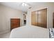 Comfortable bedroom featuring neutral walls, a ceiling fan, and closet space at 2597 Countryside Blvd # 206, Clearwater, FL 33761