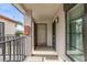 Inviting entryway showcasing the front door with modern sconce and neutral tones at 2597 Countryside Blvd # 206, Clearwater, FL 33761