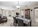 Bright living room showcasing a dining table, comfortable seating, and ample natural light at 2597 Countryside Blvd # 206, Clearwater, FL 33761