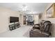 Bright and airy living room featuring comfortable seating, dining area, and neutral decor at 2597 Countryside Blvd # 206, Clearwater, FL 33761