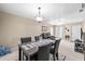 Open-concept living and dining area with modern furnishings and a neutral color scheme at 2597 Countryside Blvd # 206, Clearwater, FL 33761