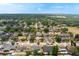 Overhead view of the home surrounded by well-maintained properties, mature trees, and accessible community green spaces at 2816 Manor Hill Dr, Brandon, FL 33511