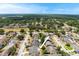 An aerial view displays homes and a pool within a well-planned neighborhood with plenty of green space at 2816 Manor Hill Dr, Brandon, FL 33511
