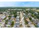 Aerial view of the home in a residential neighborhood featuring community green spaces and mature landscaping at 2816 Manor Hill Dr, Brandon, FL 33511