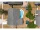 This overhead shot reveals the home's backyard with a pool, sheds, and well-maintained grounds at 2816 Manor Hill Dr, Brandon, FL 33511
