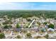 Aerial view of the home in a residential neighborhood with mature trees and well-maintained lawns at 2816 Manor Hill Dr, Brandon, FL 33511