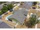 An aerial view of a residential home with a pool and an enclosed back porch and fenced-in yard at 2816 Manor Hill Dr, Brandon, FL 33511