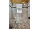 Shower stall in the bathroom featuring tiled walls, a window, and a built-in bench seat at 2816 Manor Hill Dr, Brandon, FL 33511