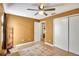 Bedroom featuring a tiled floor, ceiling fan, decor posters, and natural light at 2816 Manor Hill Dr, Brandon, FL 33511