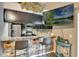 Charming kitchen bar with granite countertop and stainless steel appliances are ideal for entertaining at 2816 Manor Hill Dr, Brandon, FL 33511