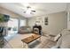 Comfortable living room with a fireplace, neutral carpet, and access to the outdoor patio at 2816 Manor Hill Dr, Brandon, FL 33511