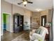 Cozy living room with decor, wood floors, and access to other rooms in the house at 2816 Manor Hill Dr, Brandon, FL 33511