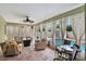 Relaxing covered patio with seating and curtains by the pool at 2816 Manor Hill Dr, Brandon, FL 33511
