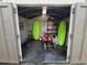View inside of a large open door shed with kayaks, an ATV and other recreational items at 2816 Manor Hill Dr, Brandon, FL 33511
