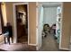 View looking into the bathroom and walk-in closet, which includes white shelving and storage space at 2816 Manor Hill Dr, Brandon, FL 33511