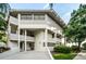 Modern building exterior with clean lines, offering covered parking and easy access to waterfront views at 300 S Florida Ave # 200J, Tarpon Springs, FL 34689