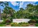 Welcome to Sunset Shores, a community surrounded by lush greenery, palm trees, and scenic landscaping at 300 S Florida Ave # 200J, Tarpon Springs, FL 34689
