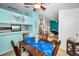 Bright dining room features modern decor, ceiling fan, and seating for four at 300 S Florida Ave # 200J, Tarpon Springs, FL 34689