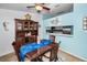 Dining room features a wood table with seashell accents, built in hutch, and seating for four at 300 S Florida Ave # 200J, Tarpon Springs, FL 34689
