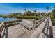 Community dock with bench overlooking waterfront and lush landscaping offering a scenic outdoor retreat at 300 S Florida Ave # 200J, Tarpon Springs, FL 34689