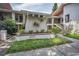 Well-maintained condo complex exterior with manicured landscaping and inviting walkways at 300 S Florida Ave # 200J, Tarpon Springs, FL 34689