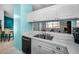Bright kitchen features a double sink, white cabinets, and an open view to another room, great for entertaining at 300 S Florida Ave # 200J, Tarpon Springs, FL 34689