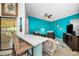 Bright living room with counter seating and comfortable furniture at 300 S Florida Ave # 200J, Tarpon Springs, FL 34689