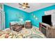 Comfortable living room with entertainment center and cozy seating arrangements at 300 S Florida Ave # 200J, Tarpon Springs, FL 34689