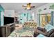 Inviting living room features an entertainment center and cozy seating arrangements at 300 S Florida Ave # 200J, Tarpon Springs, FL 34689