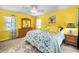 Bright main bedroom features a ceiling fan, dresser, large windows, and beachy decor, creating a relaxing atmosphere at 300 S Florida Ave # 200J, Tarpon Springs, FL 34689